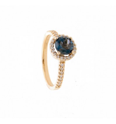 Anillo de oro rosa con topacio London Blue