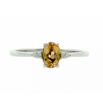 Anillo de oro blanco con diamante y topacio